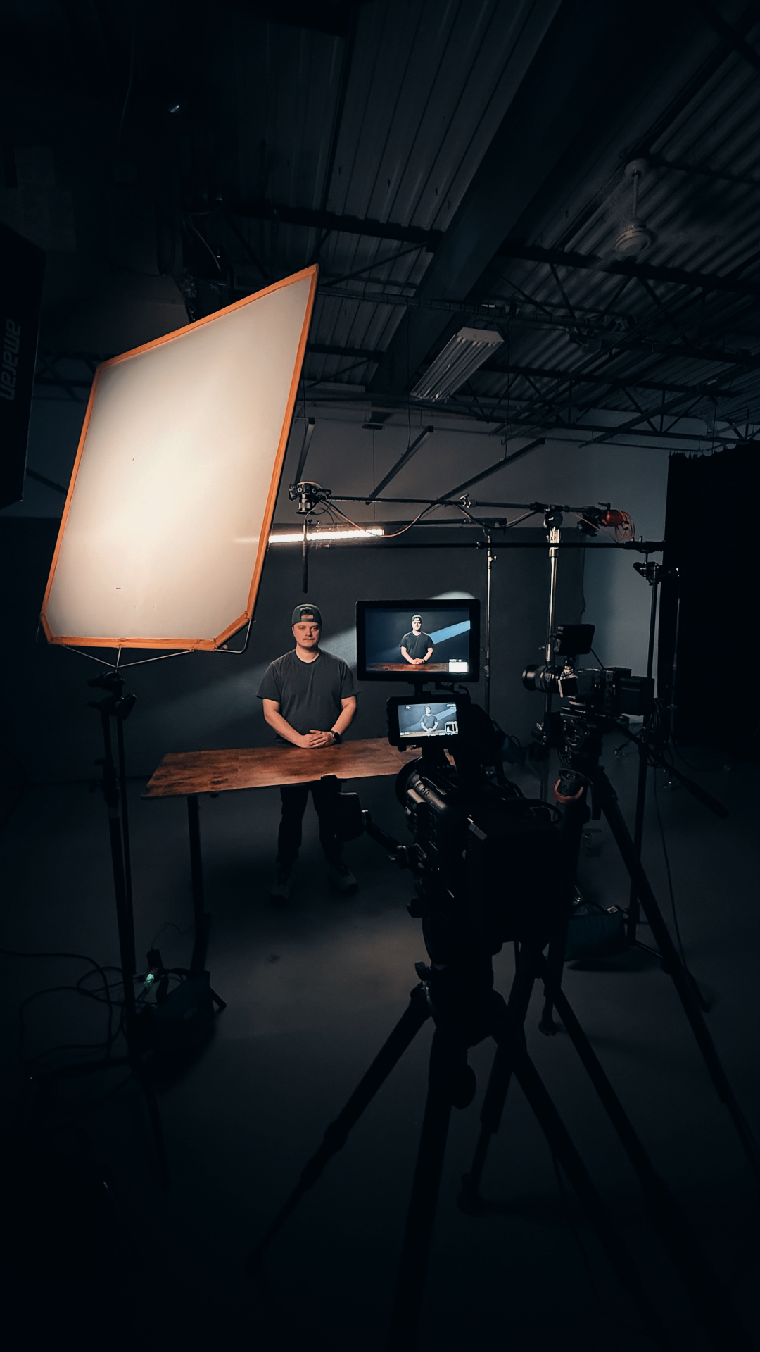 Studio interview set with a large softbox and camera on a dolly