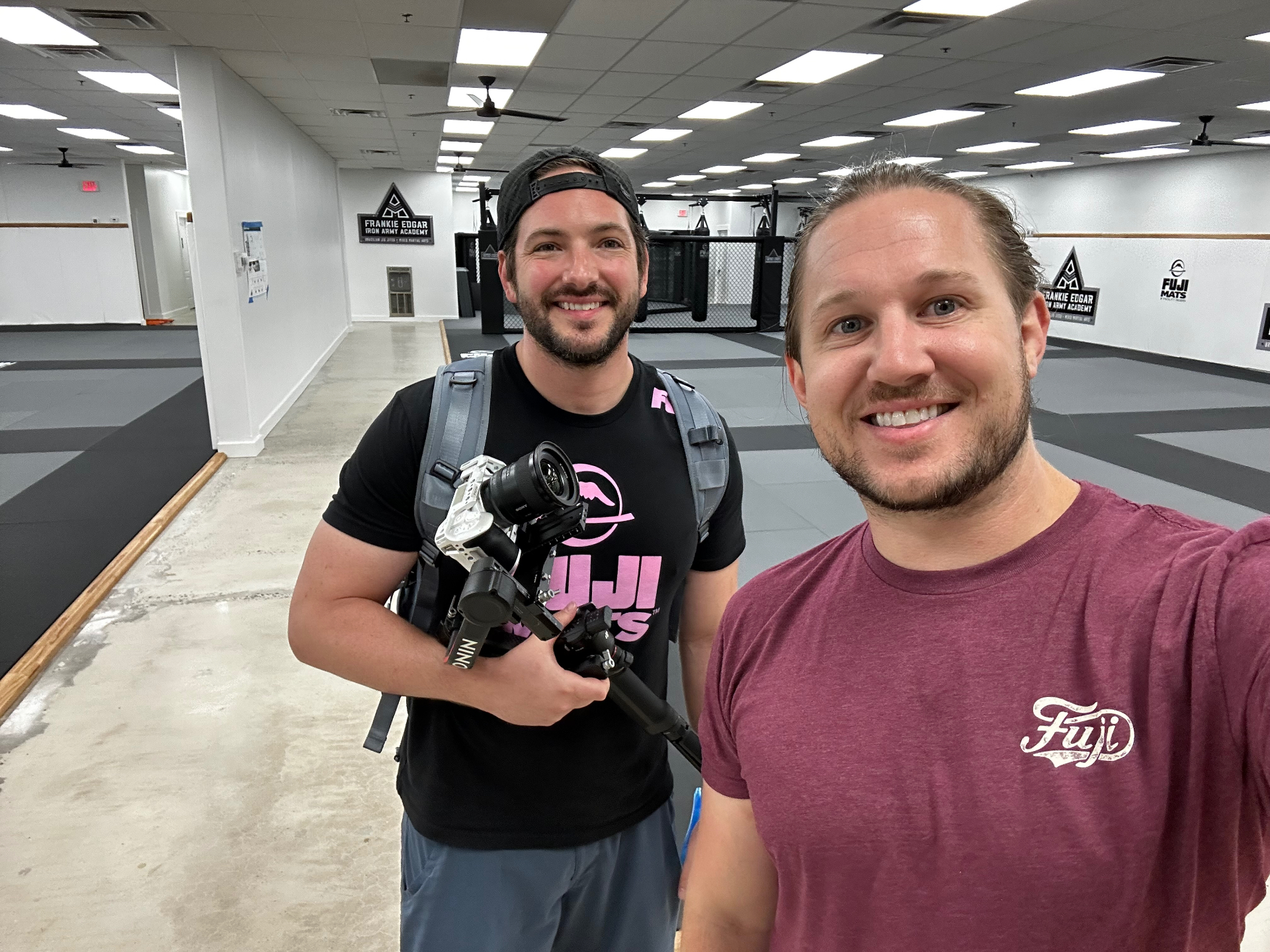 Spencer with a gimbal rig on the training floor at Frankie Edgar Iron Army Academy