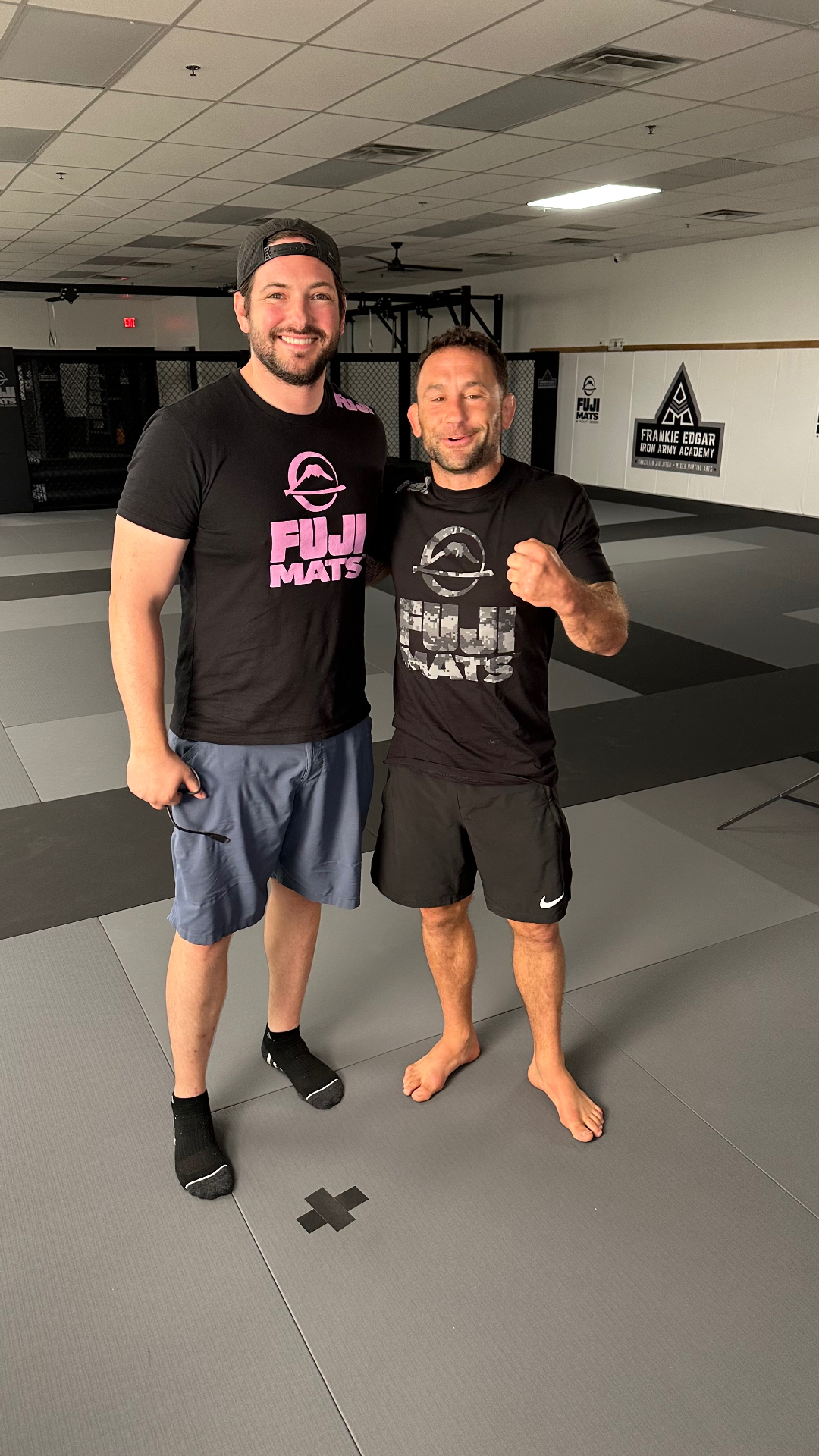 Spencer with Frankie Edgar on the mats at Frankie Edgar Iron Army Academy